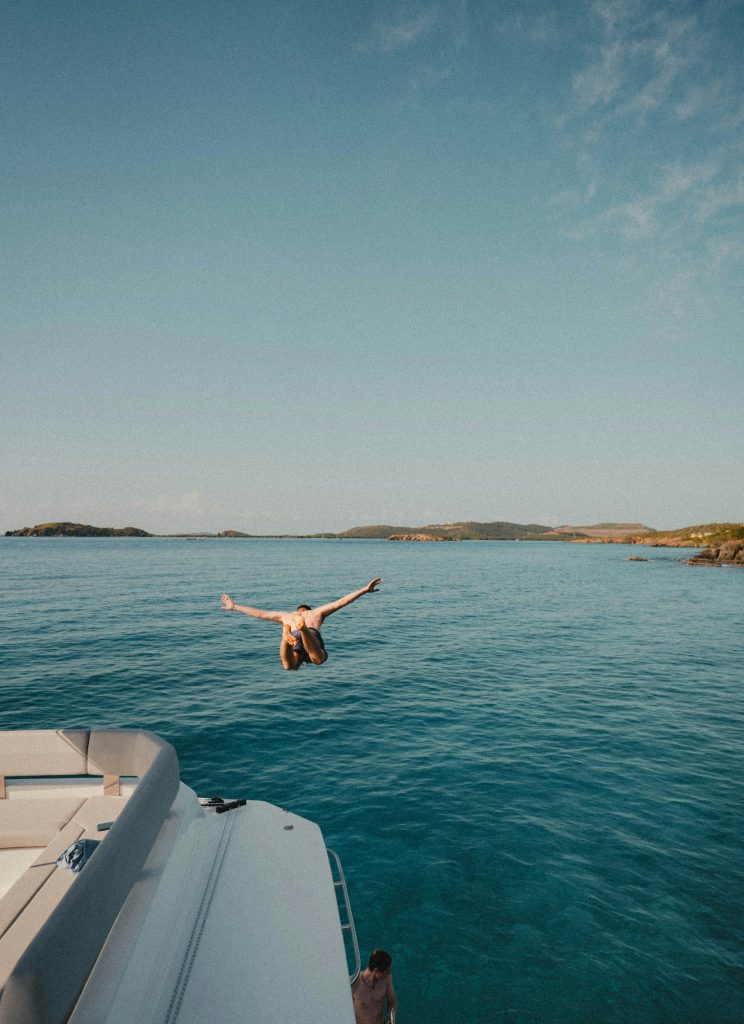 Diver entering the water from a dive boat