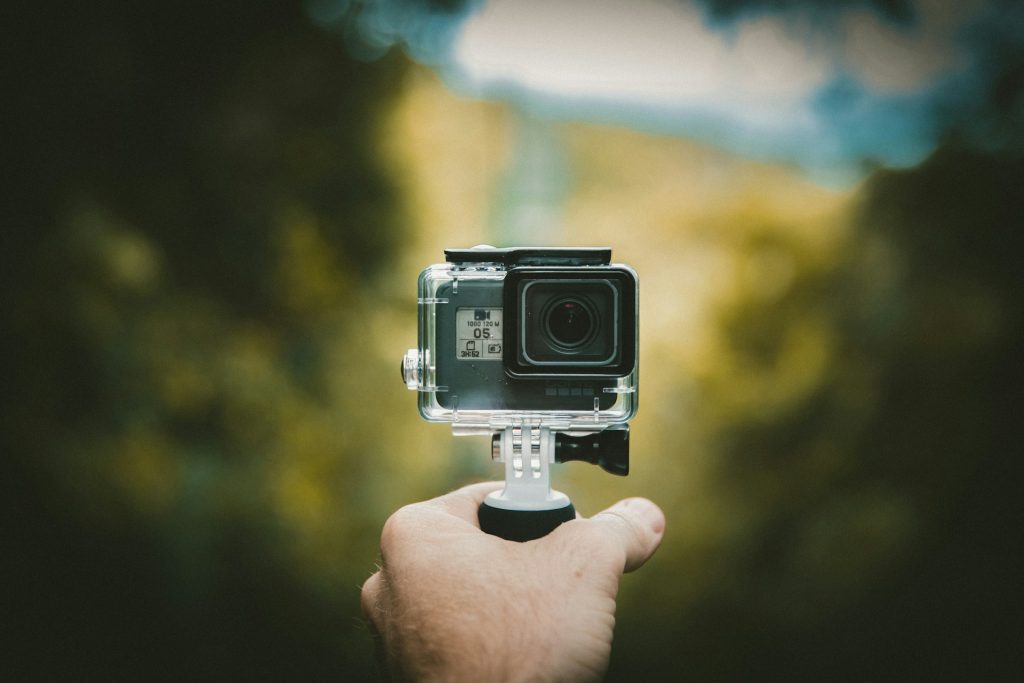 Diver holding an action camera before a dive