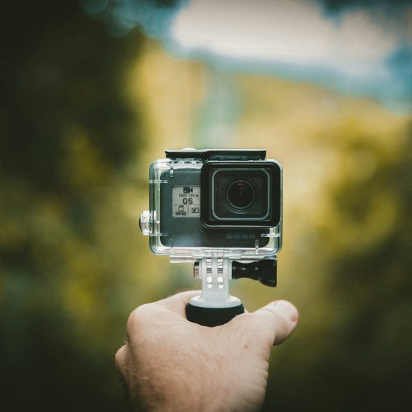 Person holding an action camera